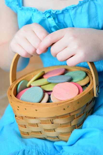 Dyed colored wooden discs for learning or playing