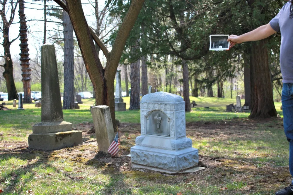 Original ghost photo next to gravestones