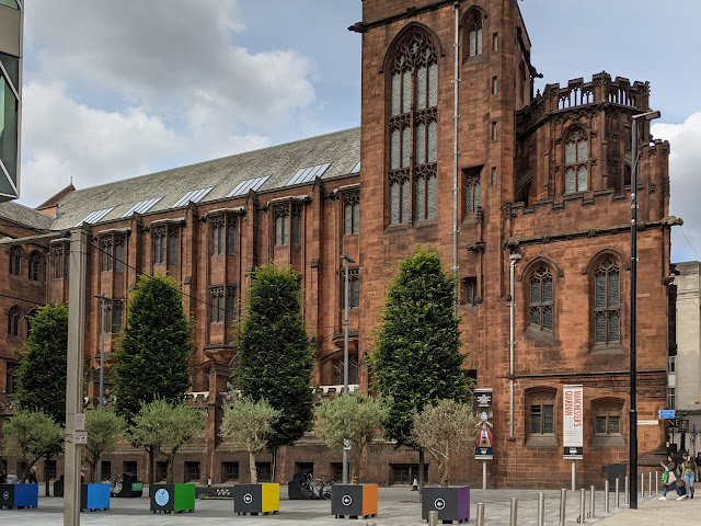 Gothic building in red stone with tower