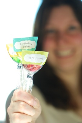 Susan holding three lollipops