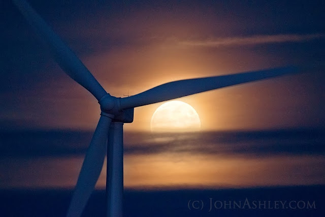 Full moon rising behind wind turbine near Shelby, MT (c) John Ashley