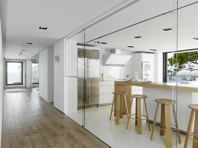 Modern kitchen with glass wall 