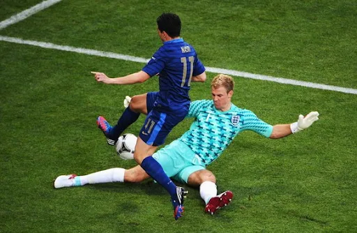 England goalkeeper Joe Hart tries to tackle France midfielder Samir Nasri