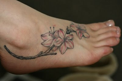 legs tattoo flowers