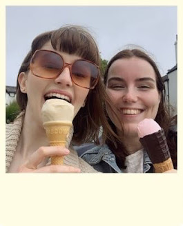 Little polaroid style picture of Ellie and friend, eating salted caramel and strawberry ice cream, hair flying in the wind and wearing sunglasses.