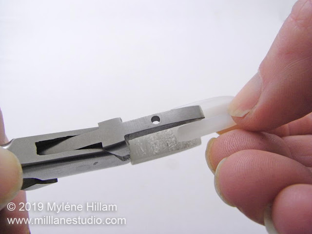 Sliding the nylon sleeve onto the pliers