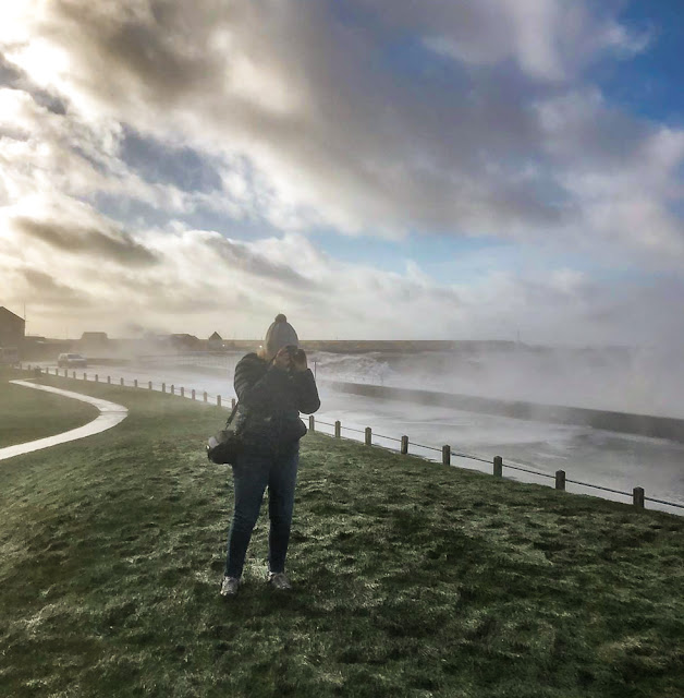 Photo of me taking photos of the wild weather along Maryport Promenade during Storm Ciara