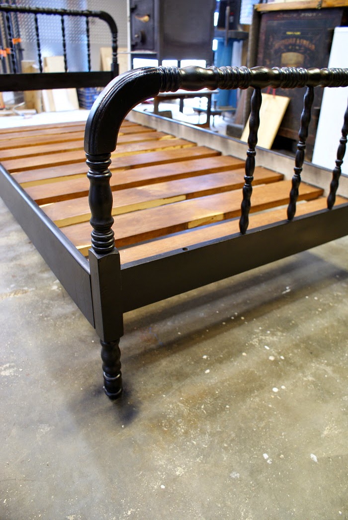 Salvaged black Jenny Lind style bed in boy's bedroom