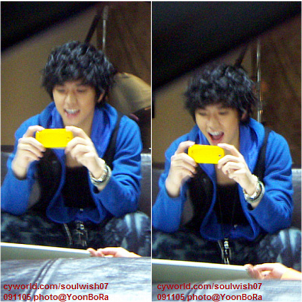  pic of my Wooyoung holding the phone cutely kekekeke what a reason