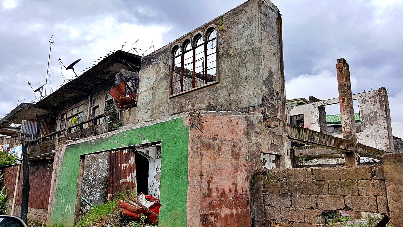 a battered (bombed and gunned) congressman's house at the "safe zone" of Marawi City