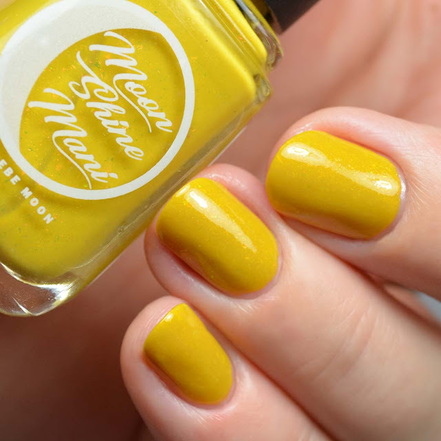 mustard crelly nail polish with flakies