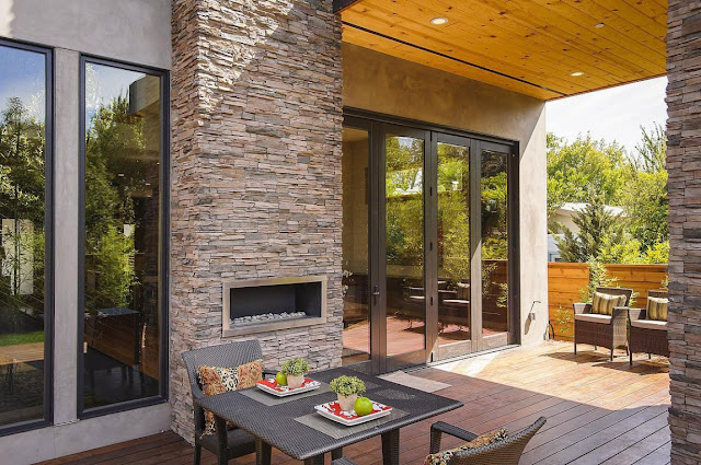 Table and outdoor fireplace in the Contemporary Style Home in Burlingame
