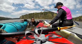 rescuing swimmer with kayak