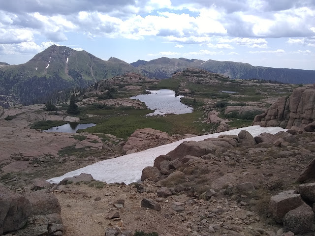 three lakes in grassy flat area