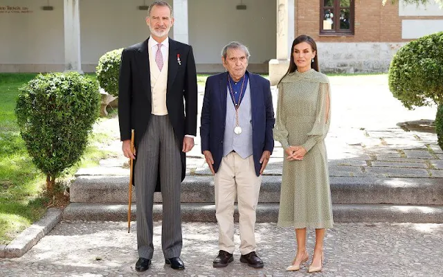 Queen Letizia wore a Nanda sage green polka-dot dress by Vogana. Carolina Herrera neutral leather slingback pumps