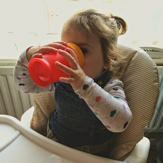 Sophia drinking out of beaker 