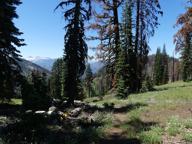 115: gear and snowy peaks