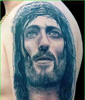 Tatuagens jesus no braço