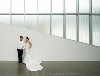 White on white - Bonnie and Manson's wedding photo at the Chihuly Garden and Glass Museum - Kent Buttars, Seattle Wedding Officiant