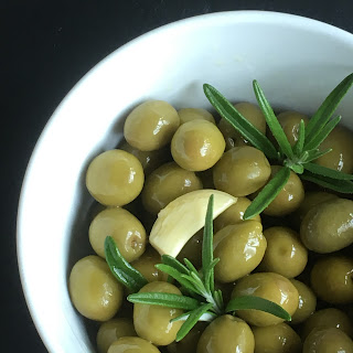 Olives marinated in olive oil, rosemary and garlic - so easy and tasty