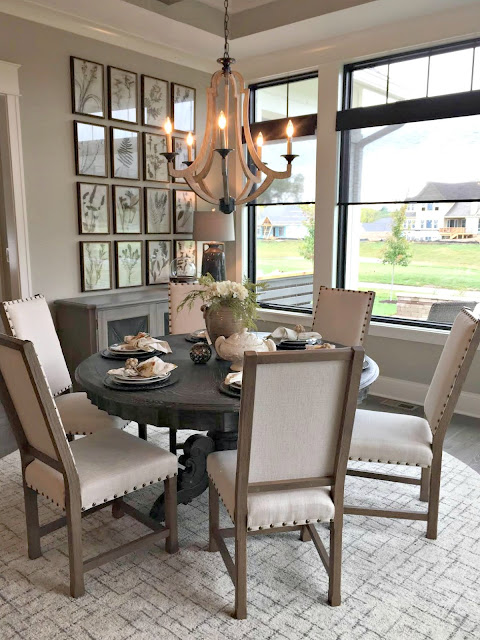 wood chandelier over round table