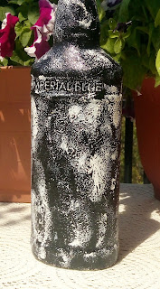 Back of recycled bottle by Anu Kriti