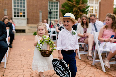 The bride and groom met in college, and have been together for three and a half years.  Maggie said that walking down the aisle towards Jordan was the best part of the day, knowing that they were surrounded by the love and support of friends and family.  She said, "As I walked towards him, Jordan and I were both tearing up and we couldn't look away from each other."  Jordan said that since he was "anxious all day, to the point of feeling sick," the first look was the most memorable part of the day.  He said, "The moment I saw Maggie, I felt 100% relieved, and it made the hours before the ceremony so much more enjoyable."    The Festivities Event Center in El Reno, OK, was the perfect wedding backdrop, with 10' windows, a whole second floor to get ready in, and a romantic setting for the outdoor nuptial.  The bride looked "drop-dead gorgeous" in her lace-embroidered, strapless, wedding gown, followed by her bridesmaids, dressed in individually designed gowns in soft hues of dusty rose.  Each bridesmaid had a spring floral bouquet, similar to the bride's bouquet of pastel pink roses and lilies.    After the couple exchanged wedding vows, pictures of the family and wedding party were taken, and it was time to celebrate!  First dances came next, then guests were invited to enjoy a Mexican buffet.  Dessert included the gorgeous wedding cake, chocolate groom's cake, and assorted, homemade cookies and pastries.  The evening came to a close as the guests sent the star-gazed couple off with sparklers!  The newly married couple escaped to Cozumel and Yucatan Progreso for their honeymoon.  