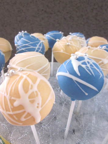 Filled with a mixture of flavoured cake pops dipped in blue light yellow 