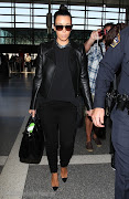 Airport Chic, Kim Kardashian. Kim Kardashian on her way to London in a pair . (kim kardashian touches down in london airport )