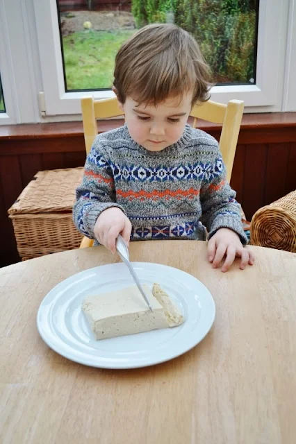 How to prepare tofu step four - After the moisture has drained out, slice tofu into fingers.