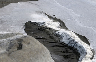 Water running below the ice