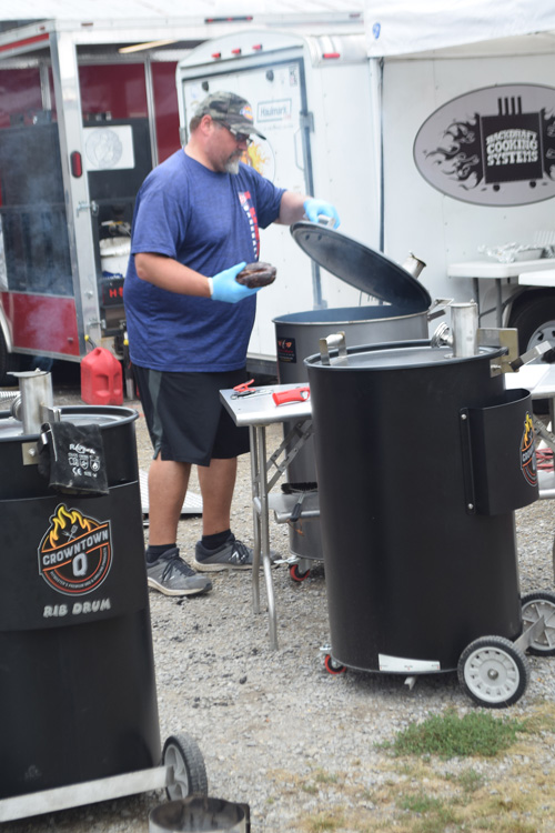 Cooking on drum smokers at the 2019 Praise The Lard BBQ Contest