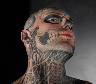 Skull and body organs tattooed on the face and body.