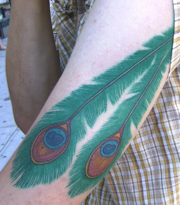 indian feather tattoos. bright, colorful tattoo: