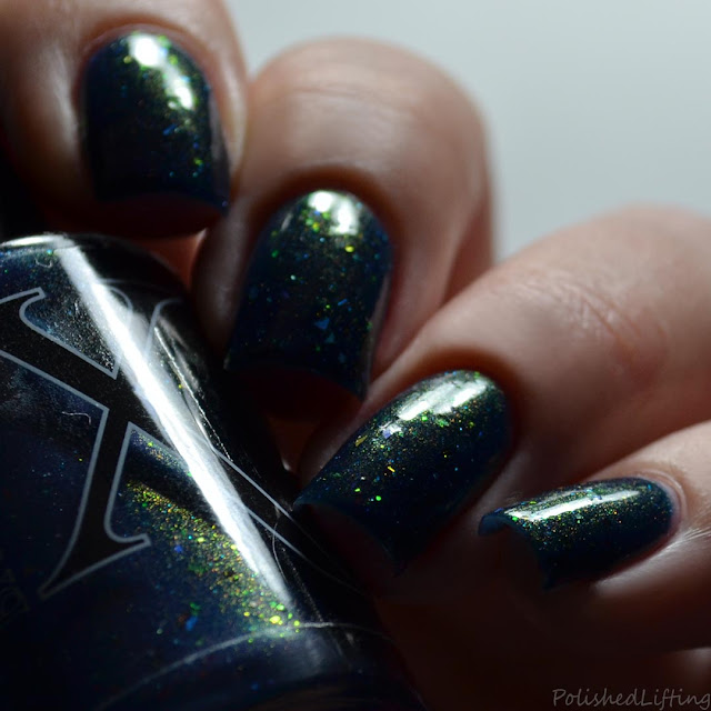 blue nail polish with shifting shimmer and flakies