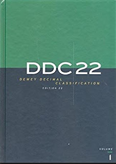 Book cover, first volume of DDC 22. Cover is divided horizontally into two shaded quadrants, with roughly the top one-third shaded green and the bottom two-thirds gray-to-blue.