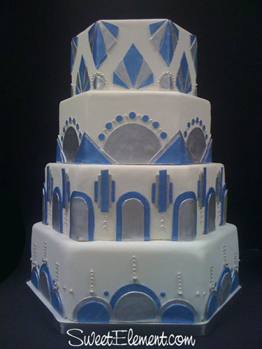 A white blue and silver hexagon shaped Art Deco wedding cake designed by