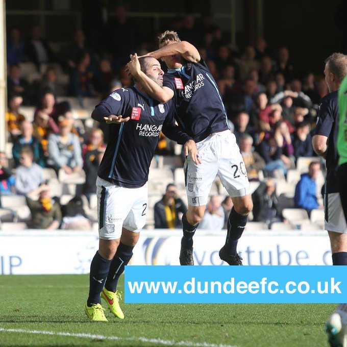 Dundee player Gary Harkins celebrates goal with WWE's famous RKO move
