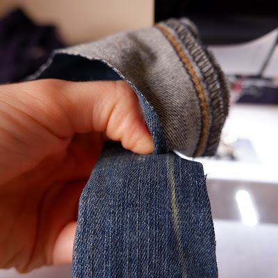 Flat Felled Jeans Seam step 2. Lay one side over the other as they will be when finished, lining up the folded-under raw edge with the original seamline.