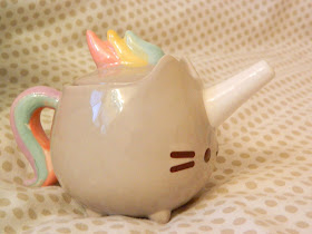 A pusheen/pusheenicorn mini tea pot or watering can 