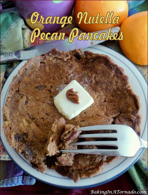 Orange Nutella Pecan Pancakes feature fresh orange puree, crunchy pecans, and a hint of Nutella. | recipe developed by www.BakingInATornado.com | #recipe #cook