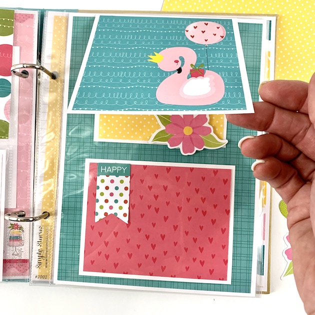 Birthday Scrapbook Mini Album Page with a pink swan, colorful dots, flowers, and hearts