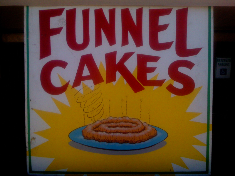 very unfortunate funnel cake sign at a fair in Austin, TX