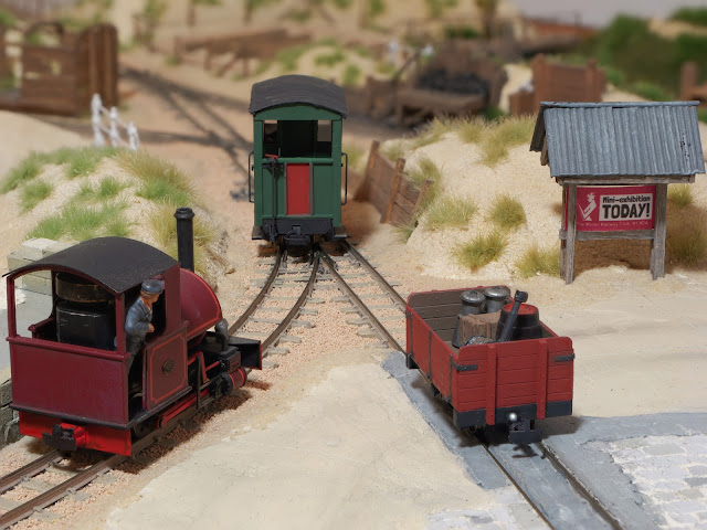 The new brake van is seen on the layout, alongside the Bagnall, the open wagon, and a new sign promoting the MRC exhibition!