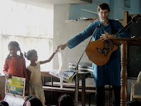 Children receiving Sabbath Calendar