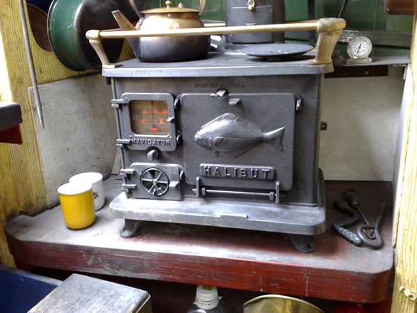 tiny, tiny, tiny cast iron wood stoves from marinestoves.com (for your 