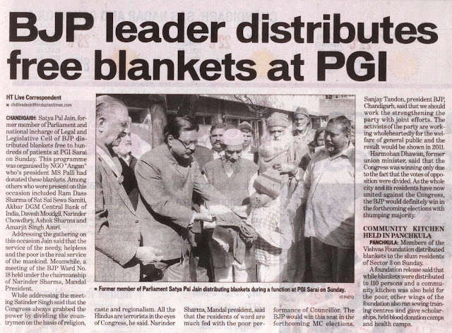 former member of Parliament Satya Pal Jain distributing blankets during a function at PGI on Sunday.