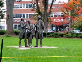 Hamilton, Washington and Lafayette statues, talking together