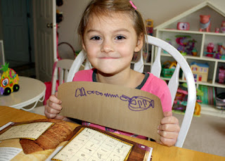 Tessa's hieroglyph note says, "I like candy." Her name is encircled with a cartouche.