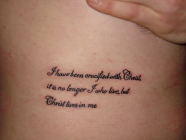 Smaller phrases or verses can also be inscribed inside a cross tattoo 